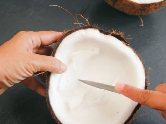  Detaching the coconut pulp - cut into pieces